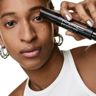 Model with MAC Cosmetics product.